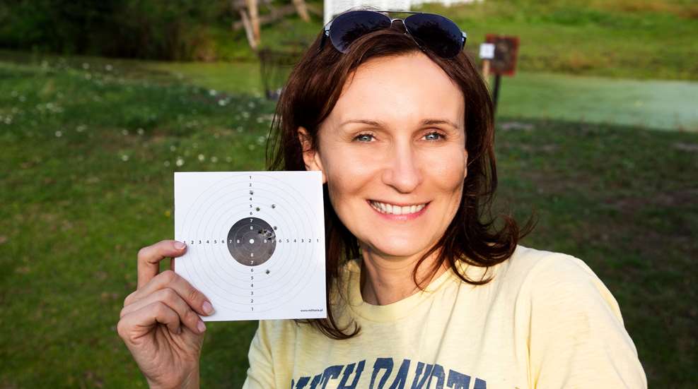Woman Holding Small Target
