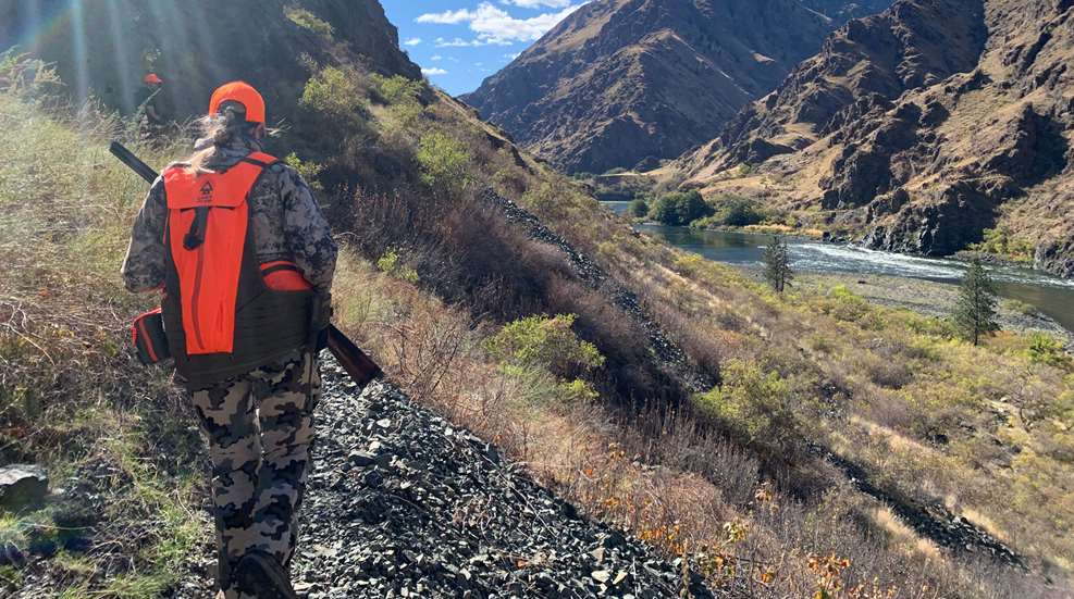 Woman Hunter Holding Shotgun