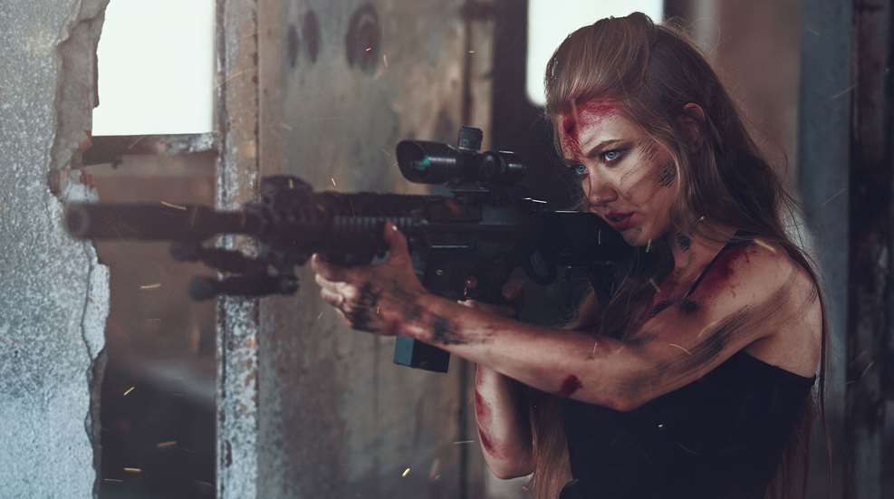 Woman Dramatically Firing Rifle