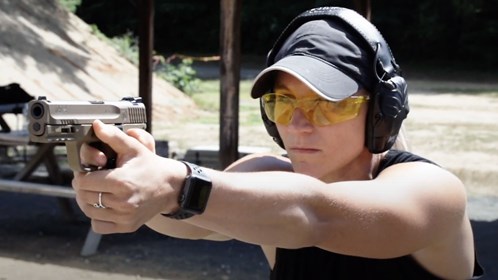 woman firing handgun