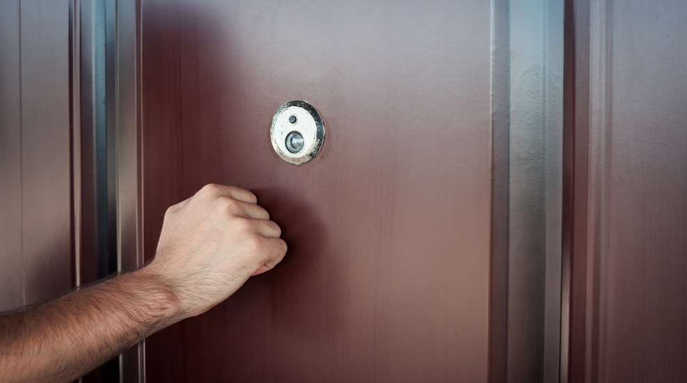 Man Knocking On Door