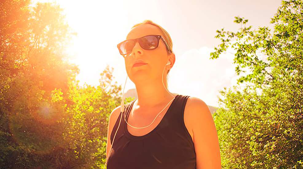 Woman with earbuds on
