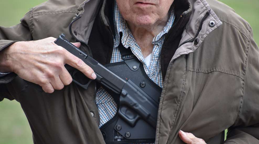 Elderly Man With Pistol In Chest Holster