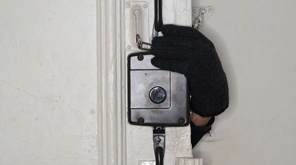 Black Glove Hand Breaking In To Home