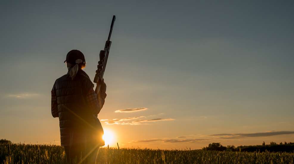 Hunter with sunset