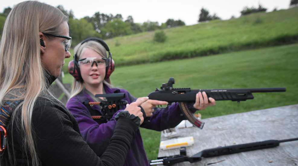 Mom Teaching Daughter To Shoot