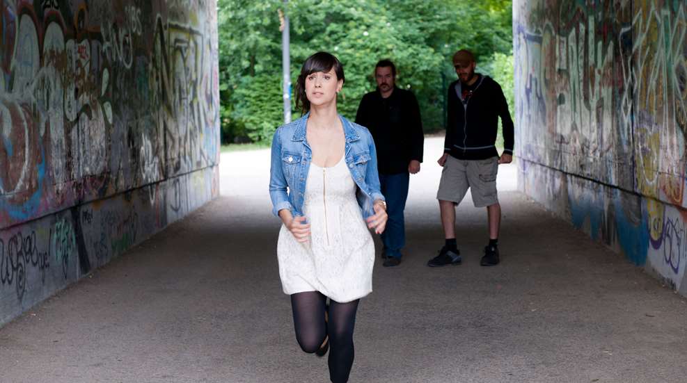 Woman Running Under Tunnel From Bad Men