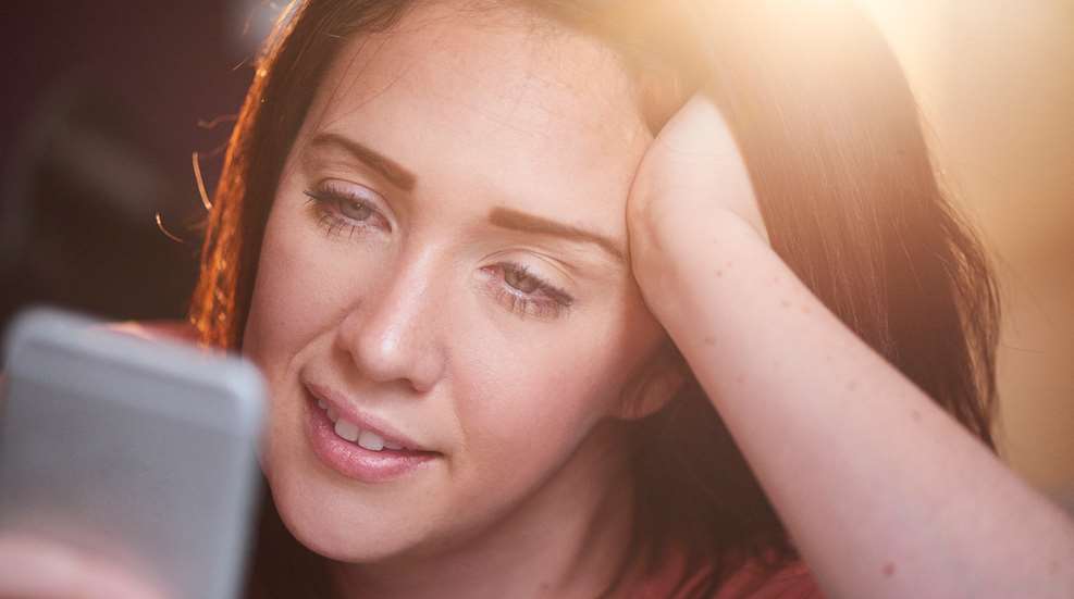 Woman Looking At Smart Phone