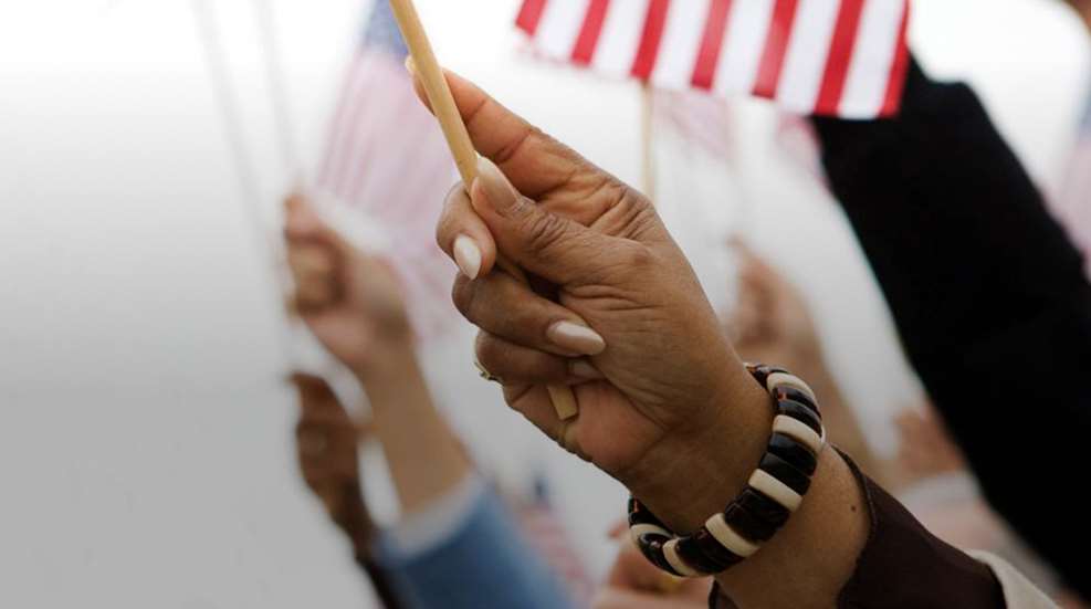 Womans Hand Holding Us Flag
