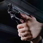NRA Women The Armed Citizen Aiming A Pistol
