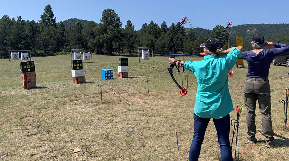 Two Women On Archery Range