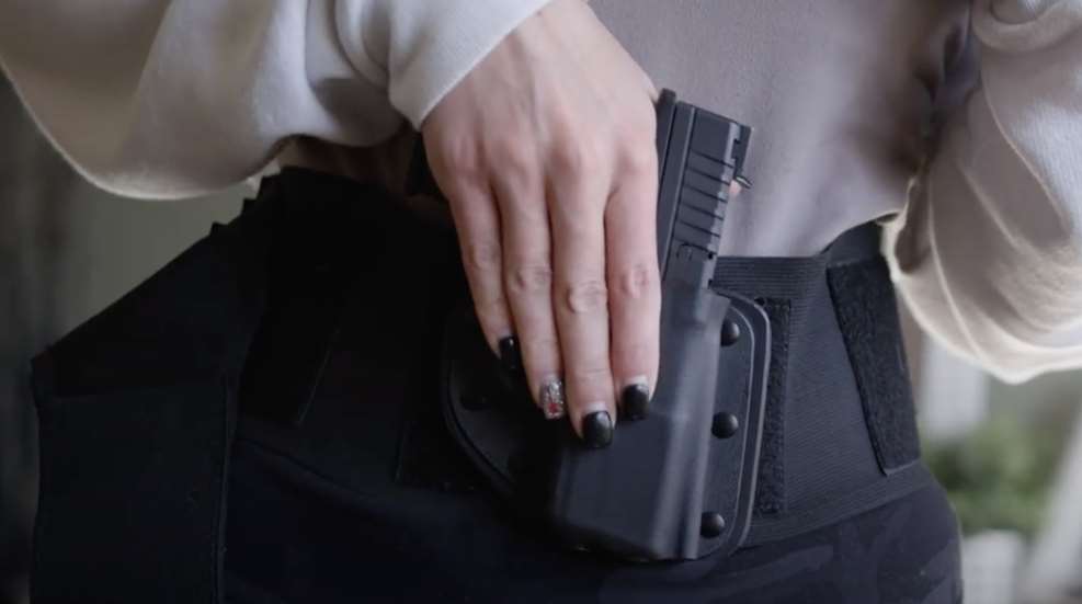 Woman Reaching Into Crossbreed Bellyband