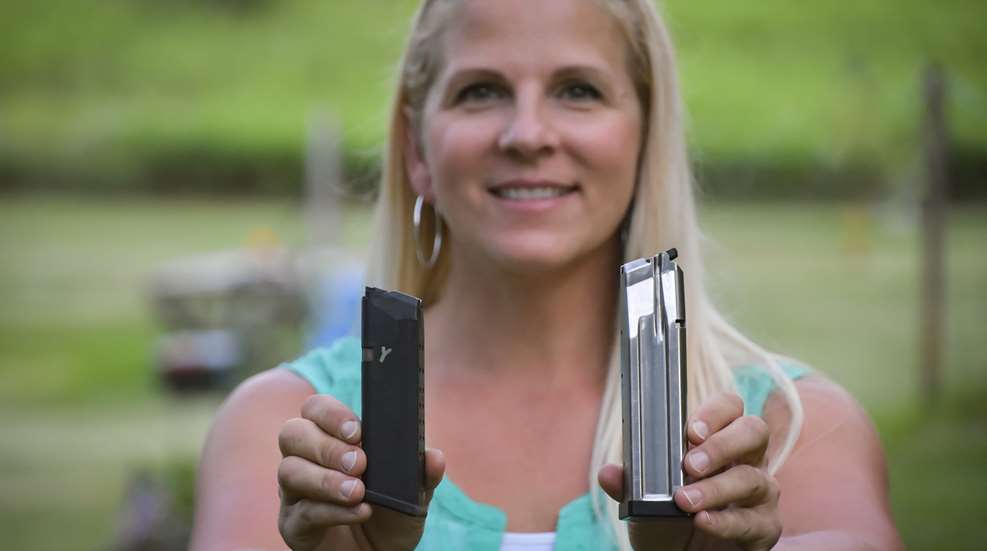 Yackley Holding Two Mags