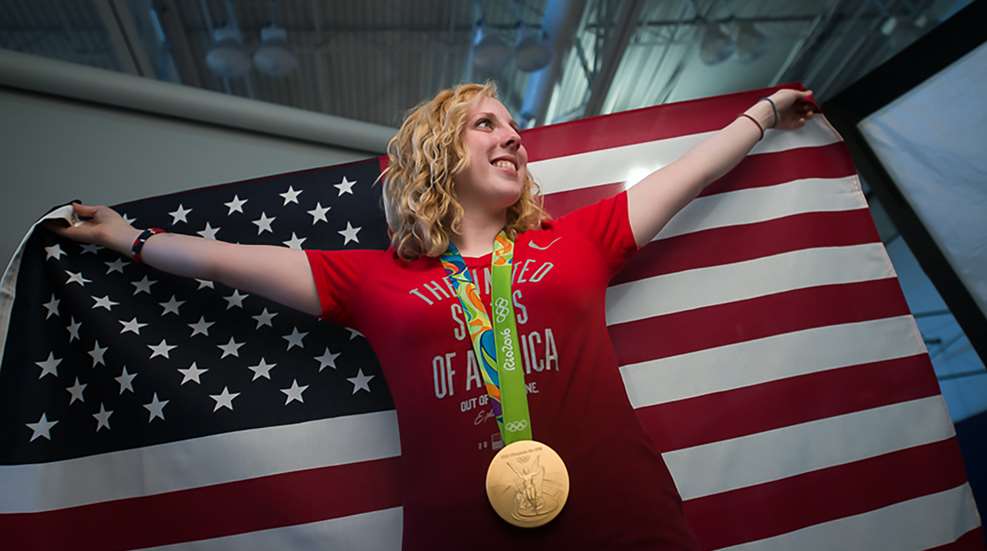 Ginny Thrasher With Medal And Flag