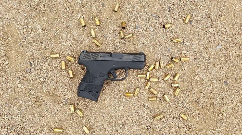 Handgun Amidst Shells