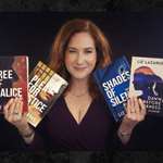 Liz Lazarus Holding Books