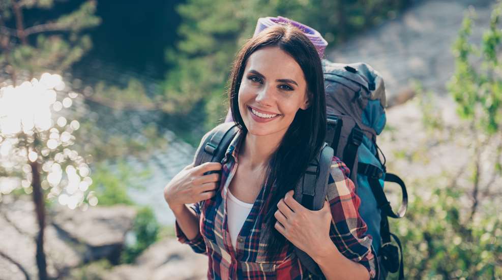Woman Backpacking In Nature