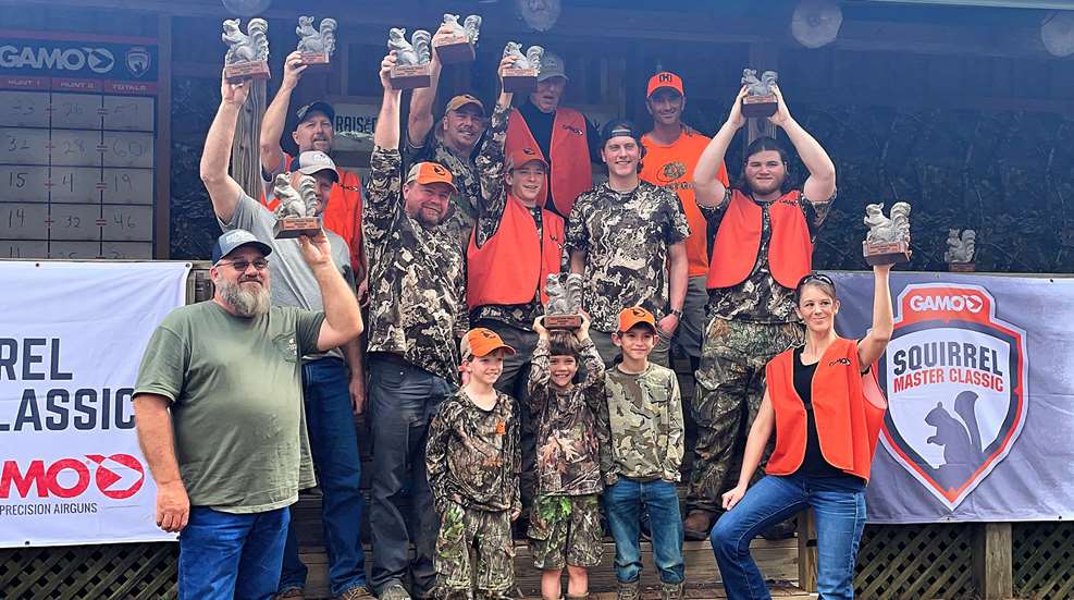 Winning Team Holding Trophies