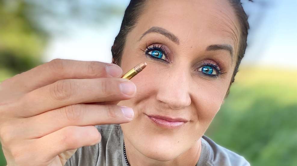 Melissa Bachman Holding 22 Winchester Wildcat Cartridge