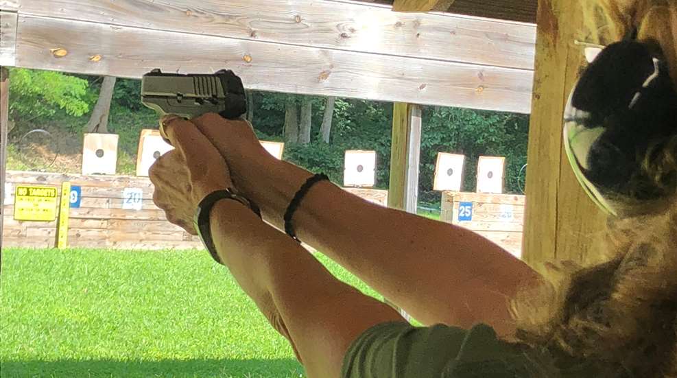 Woman Shooting A Pistol