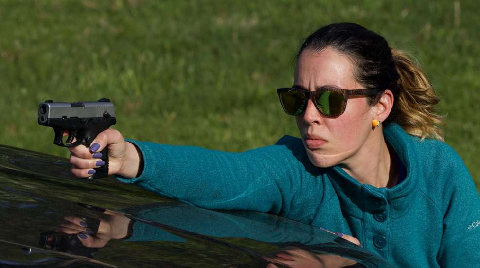 Move And Shoot Woman Shooting Over Car